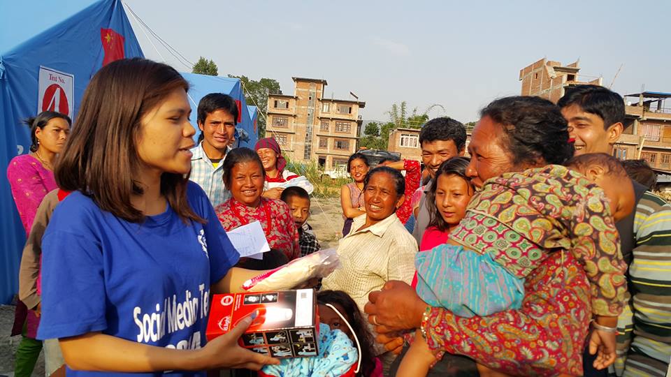 Global Peace Foundation give solar lamps to women and children in Nepal.