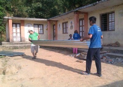Global Peace Foundation volunteers help rebuild classrooms after Nepal earthquake.