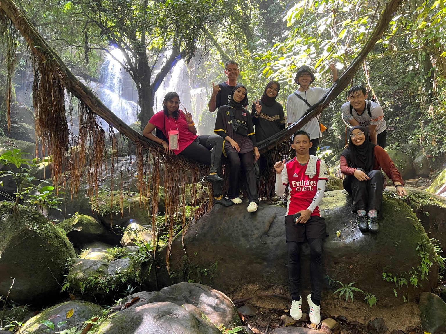 Volunteers visit a local waterfall