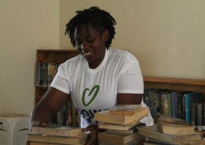 Young Woman Stacks Books