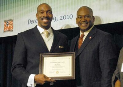 Senator Emanuel Jones presents awards to significant leaders at the Strengthening Families and Communities Coalition Summit in Atlanta, Georgia.
