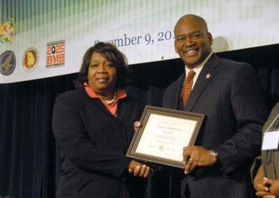 Senator Emanuel Jones presents awards to significant leaders at the Strengthening Families and Communities Coalition Summit in Atlanta, Georgia.