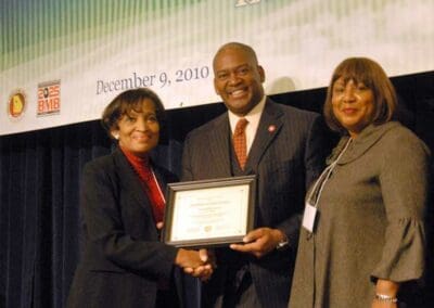 Senator Emanuel Jones presents awards to significant leaders at the Strengthening Families and Communities Coalition Summit in Atlanta, Georgia.
