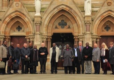 International delegates visit Clonard Monastery in Belfast.