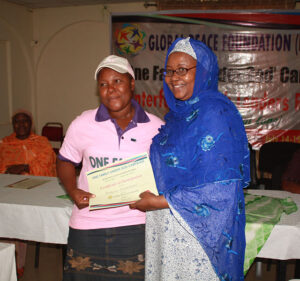 Participant receives certificate at Second Interfaith Youth Leaders Retreat