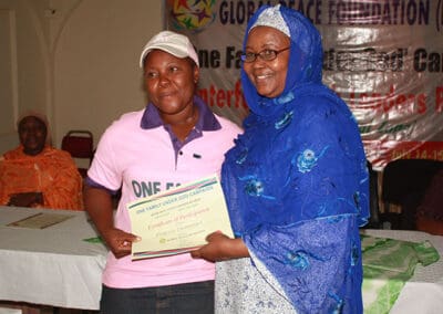 Participant receives certificate at Second Interfaith Youth Leaders Retreat