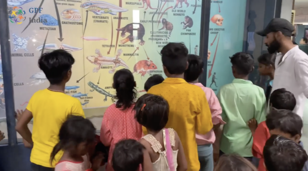 Children from the Vasudhaiva Kutumbakam Learning Center viewing an exhibit at the National Science Centre in New Delhi.
