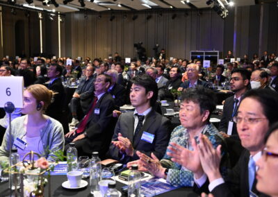 A group of people clapping at the International Forum on One Korea 2023 held in Seoul.