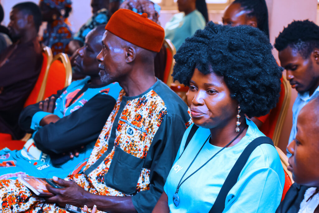 A group of people sitting at a conference in Nigeria during the International Day of Nonviolence, Kaduna.