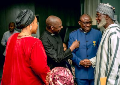 A group of people in Nigeria are shaking hands with each other, deepening democracy.