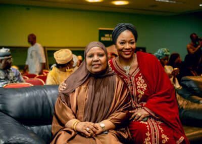Two Nigerian women posing for a photo at a Deepening Democracy event.