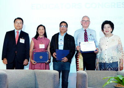 Group photo of contributors holding certificates during the sessions at the Educators Congress