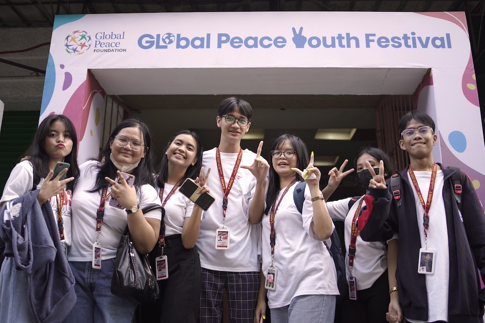 People posing at the global peace youth festival.