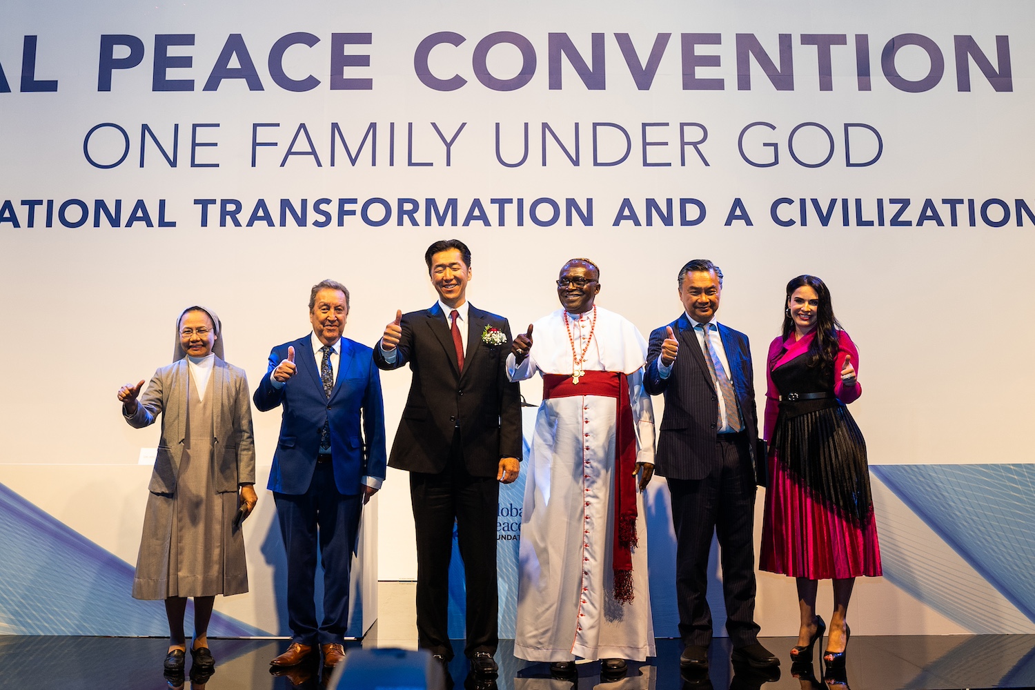 Group photo of speakers and moderator during the Main Plenary for the Global Peace Convention 2023