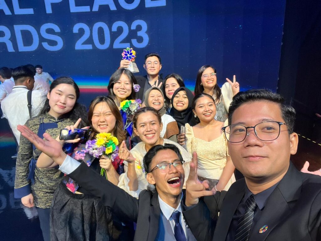 A group of volunteers posing for a photo at the Global Peace Convention in Indonesia.