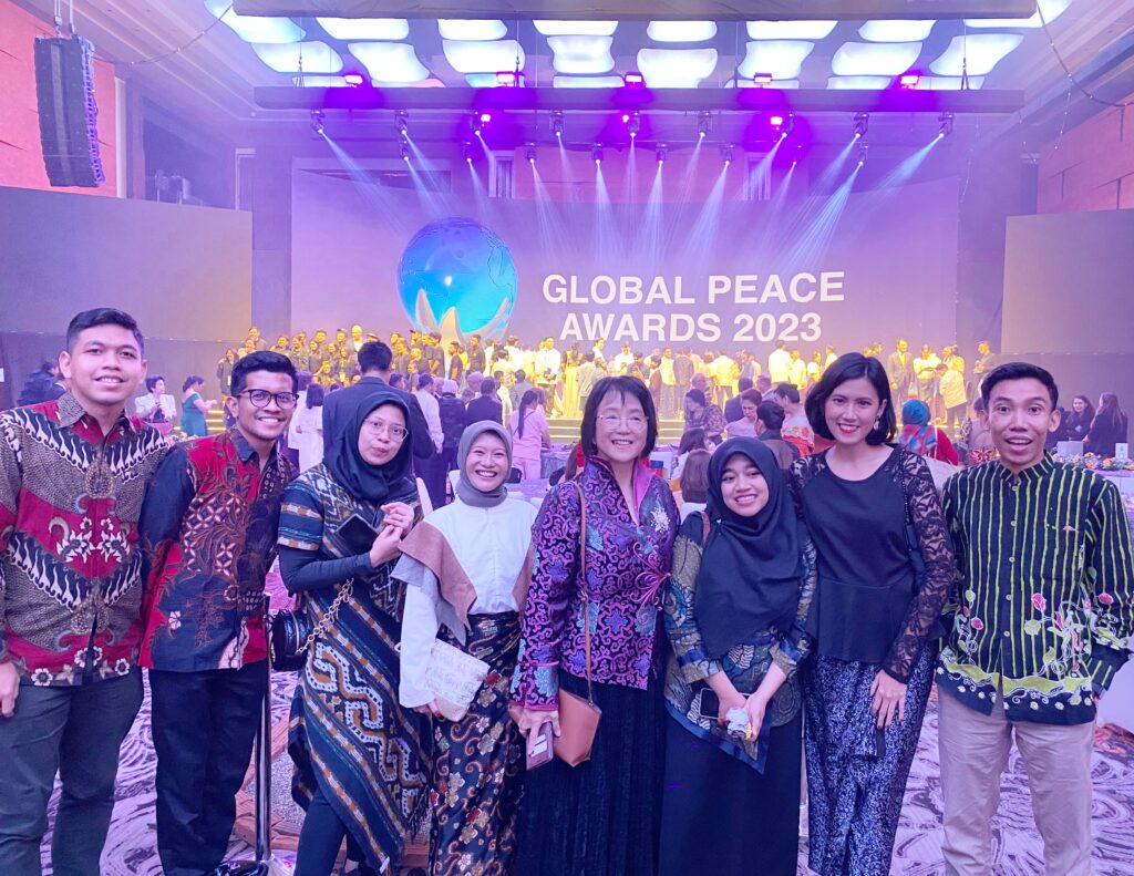 A group of people posing for a photo at the Global Peace Convention event in Indonesia.