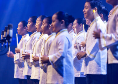 Asian children singing at a Global Peace Convention event or Awards Gala.