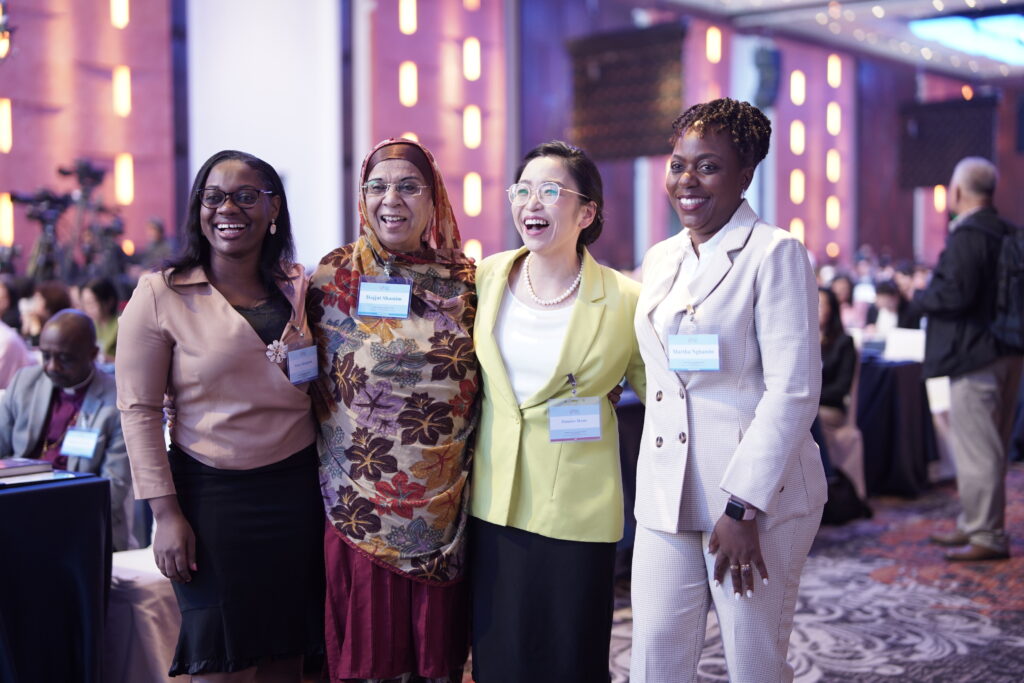 A community-driven group of women convening at an international business event.