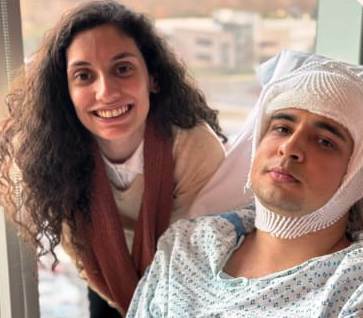 A woman standing next to a man in a hospital gown at GPF Brazil.