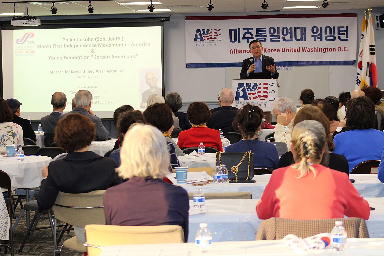 Speaker addressing an audience at a Korean American community event commemorating the March 1 Movement.