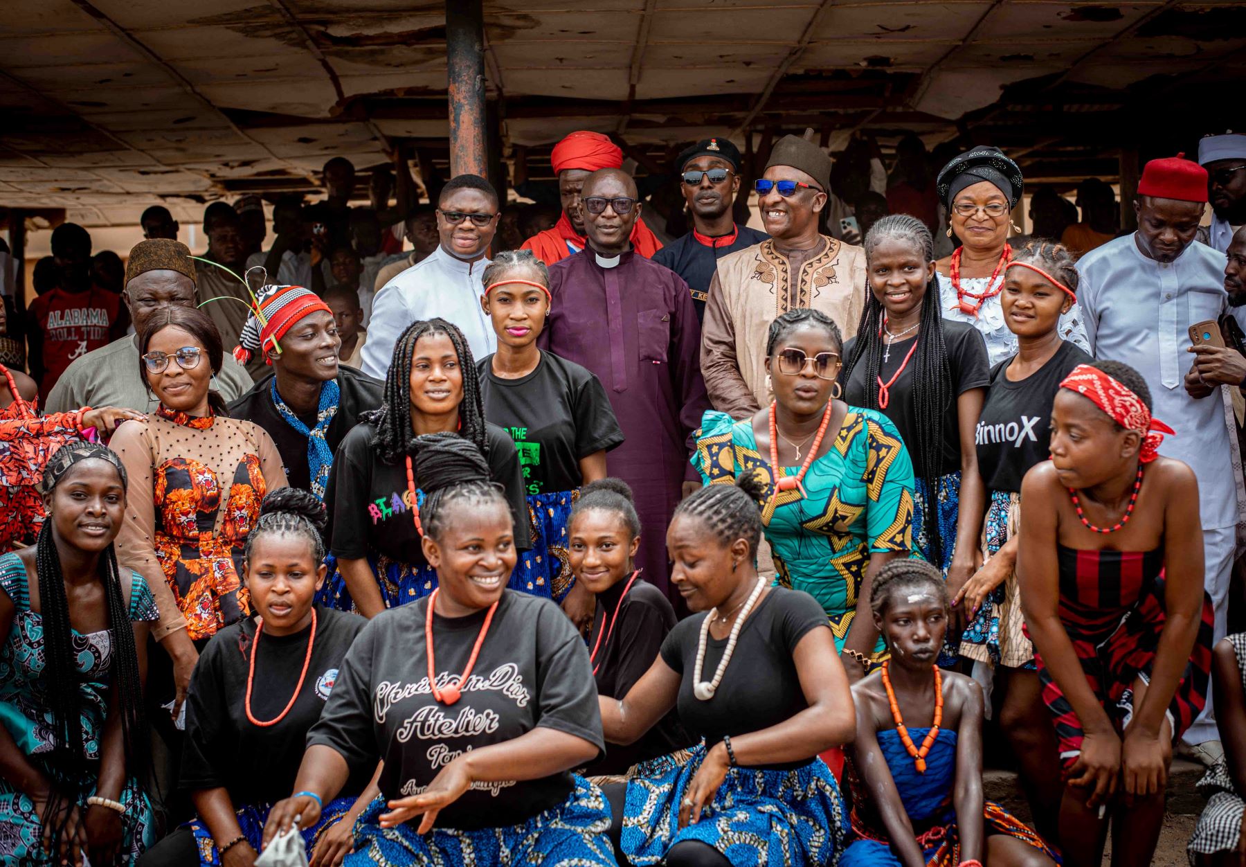 Group of hosts in traditional and casual attire posing for a photo at the GPF Nigeria Lapai Peace Festival.