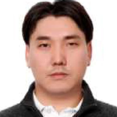 Mr. Buyandelger Davaajantsan Buyandelger Davaajantsan, a man with short dark hair, wearing a dark zip-up sweater over a white collared shirt, faces the camera with a neutral expression against a plain white background.