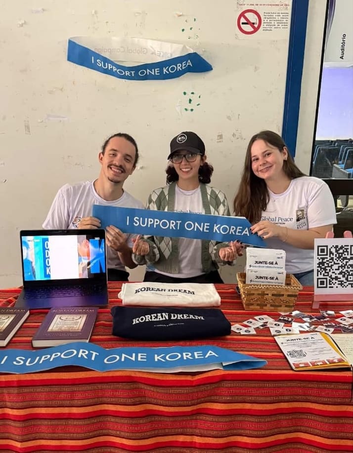 Three people at a table with 