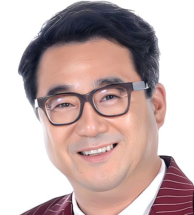 S3 Role of Korean Diaspora 1. Dr. Pil-hyun Koo Dr. Pil-hyun Koo, a man with short dark hair and glasses smiling, wears a maroon pinstripe jacket and a white shirt against a plain white background.
