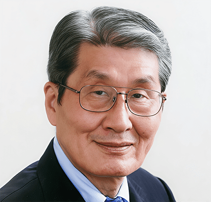 S3 Role of Korean Diaspora 5. Young-ji Kang Dr. Pil-hyun Koo, a middle-aged man with gray hair, wearing glasses, a dark suit, light blue shirt, and blue tie, smiles at the camera against a plain background.