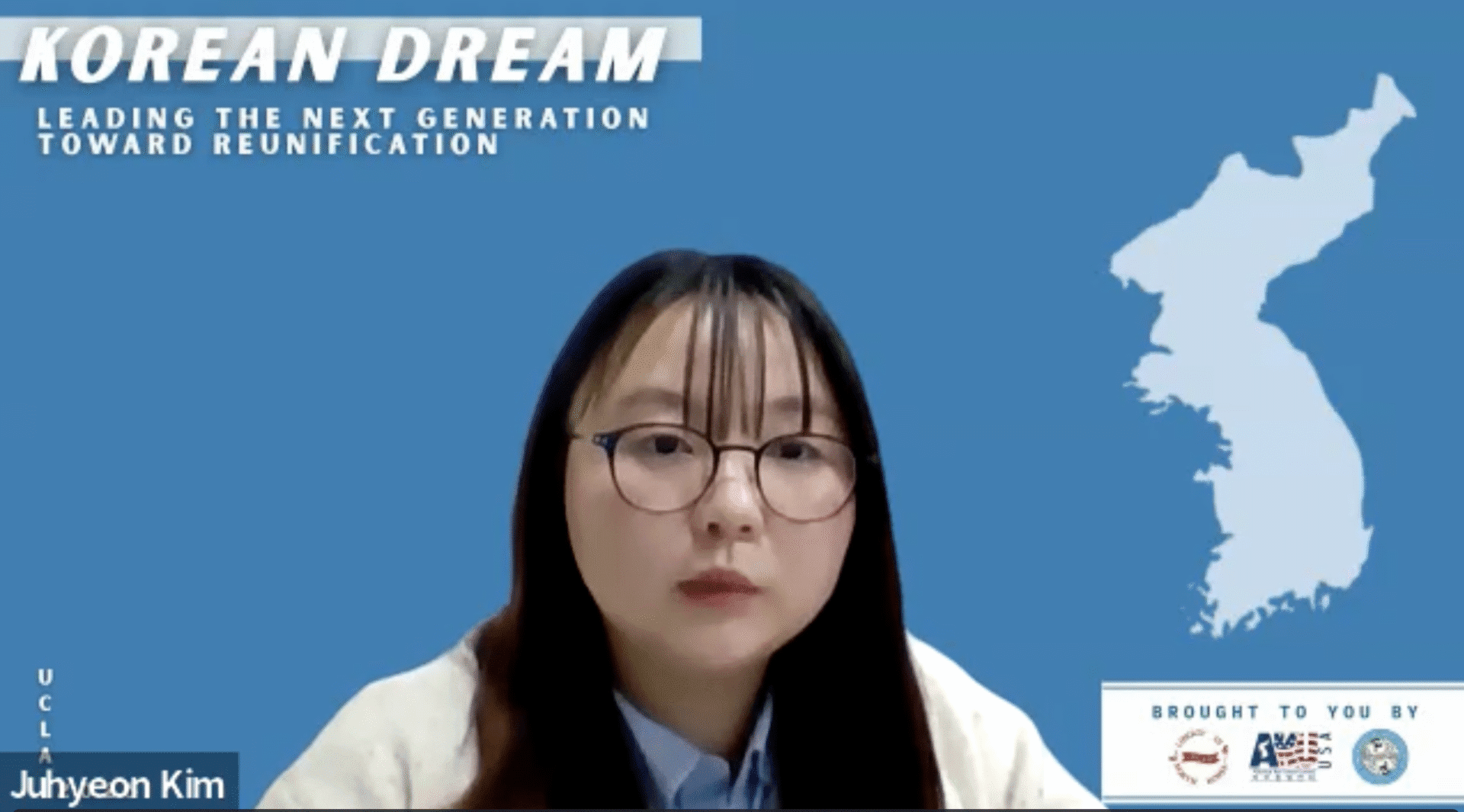 A North Korean escapee sits in front of a blue background with the words