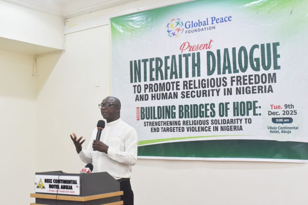 A man speaks at a podium during the 