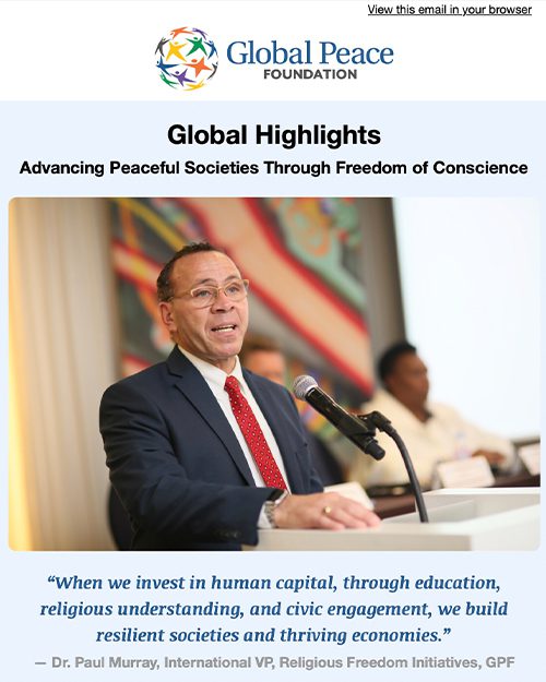 A group of women stand together, smiling and stacking hands, under a banner for Global Peace Foundation's International Day of Women event.