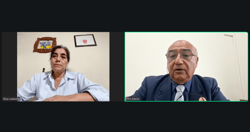 Two people are on a video call; the woman on the left sits at a table and the man on the right, representing GPW Paraguay, wears a suit and headset. Both appear to be in different indoor settings focused on peacebuilding for families.